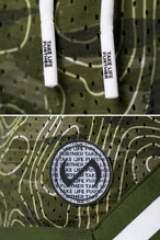 GREEN PRINT TLF Evolve Mesh 6 Inch Shorts showing Mesh Tech DNA™ fabric, striped ribbed waistband, and premium construction details by TLF Apparel – detail view