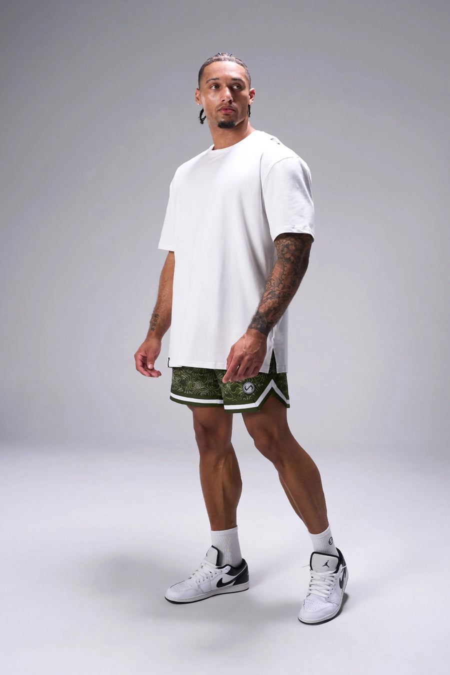 GREEN PRINT TLF Evolve Mesh 6 Inch Shorts showing 6 inch inseam fit, breathable mesh fabric, and athletic relaxed silhouette by TLF Apparel – side view