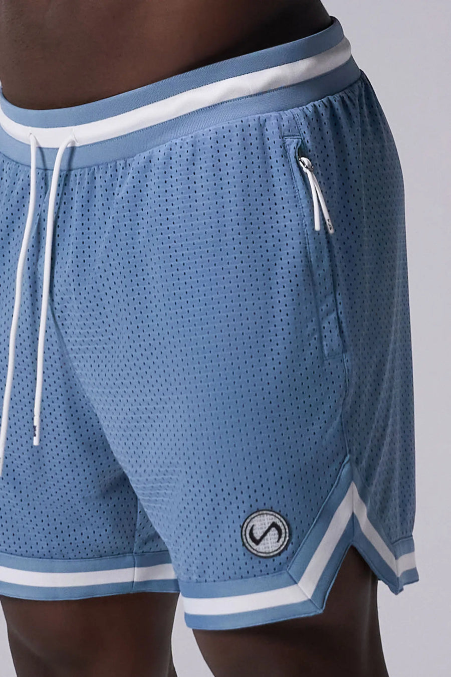 Light Blue TLF Evolve Mesh 6 Inch Shorts showing athletic side silhouette, zip pocket storage, and lightweight mesh fabric by TLF Apparel – side view