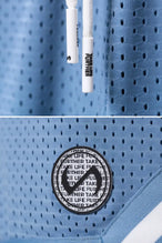 Light Blue TLF Evolve Mesh 6 Inch Shorts showing Mesh Tech DNA™ fabric, striped ribbed waistband, and premium construction details by TLF Apparel – detail view