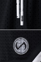 Black GTS Evolve Mesh 8 Inch Shorts showing Mesh Tech DNA™ fabric, striped ribbed waistband, and premium construction details by TLF Apparel – detail view