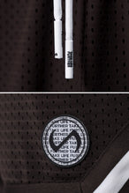 Brown GTS Evolve Mesh 8 Inch Shorts showing Mesh Tech DNA™ fabric, striped ribbed waistband, and premium construction details by TLF Apparel – detail view