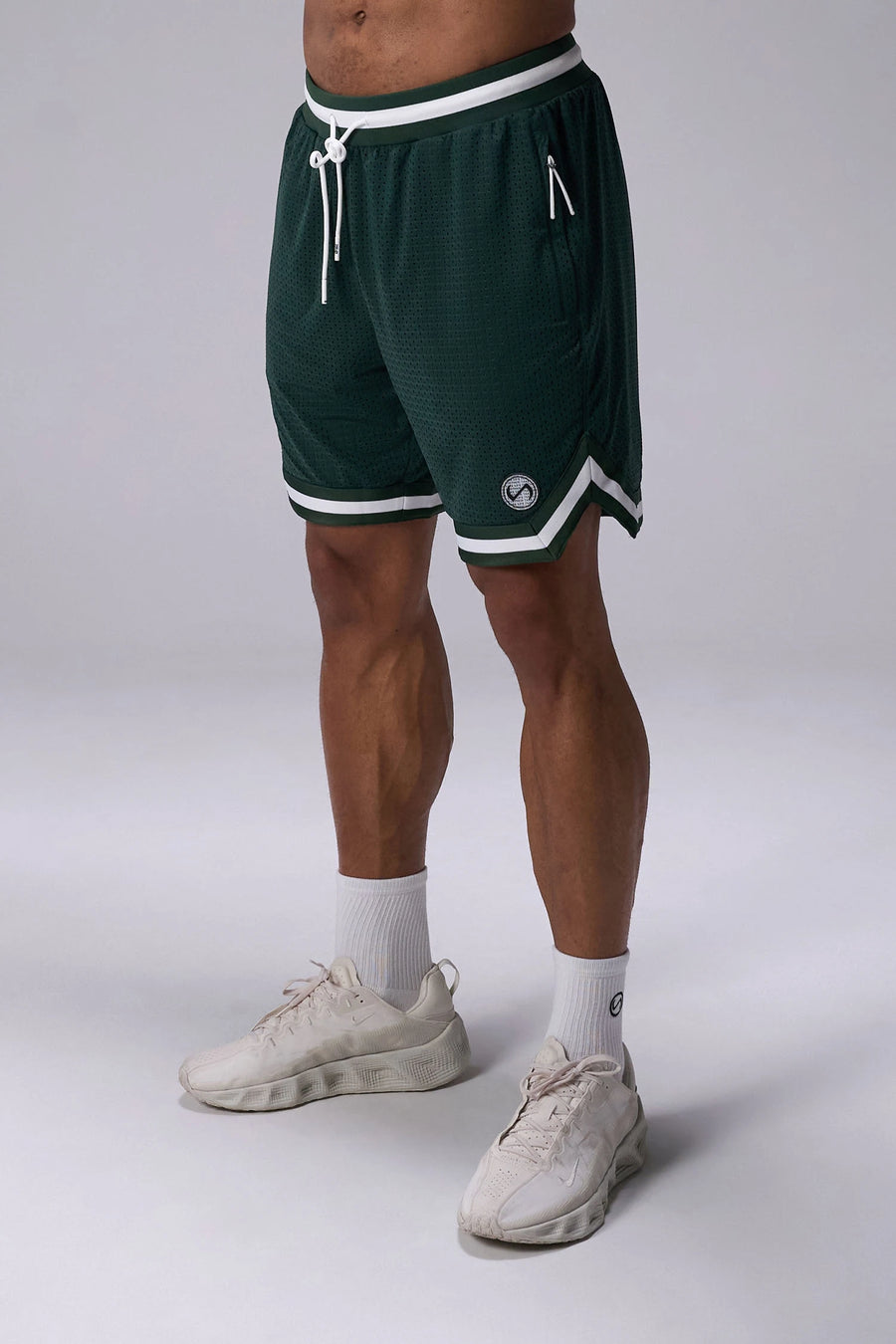 Green GTS Evolve Mesh 8 Inch Shorts with lightweight breathable mesh fabric, zip pockets, and 4-way stretch performance for gym training and workouts by TLF Apparel – front view