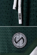 Green GTS Evolve Mesh 8 Inch Shorts showing Mesh Tech DNA™ fabric, striped ribbed waistband, and premium construction details by TLF Apparel – detail view