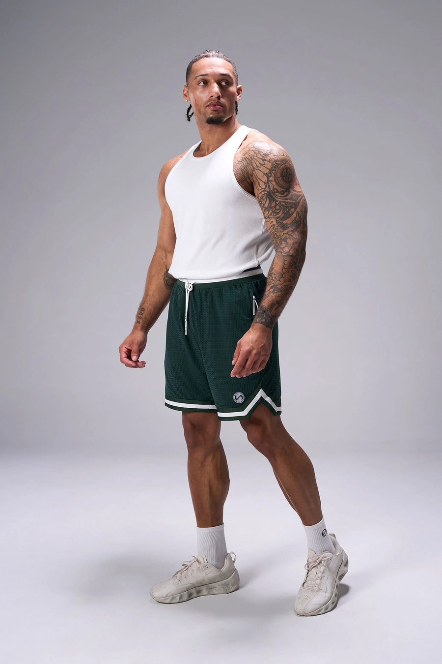 Green GTS Evolve Mesh 8 Inch Shorts showing athletic side silhouette, zip pocket storage, and lightweight mesh fabric by TLF Apparel – side view
