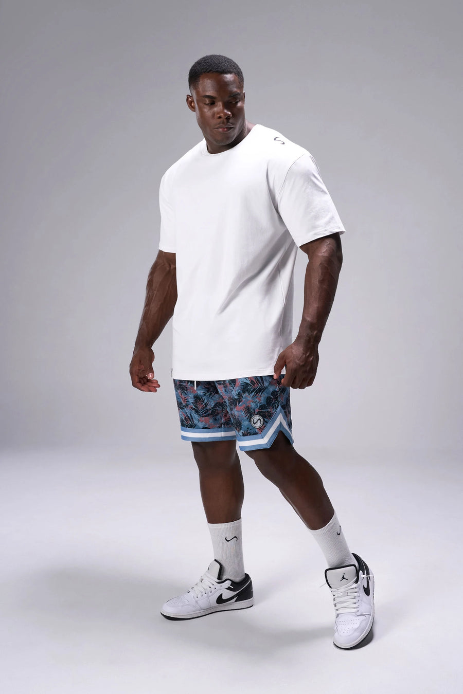 Palm Print GTS Evolve Mesh 8 Inch Shorts showing athletic side silhouette, zip pocket storage, and lightweight mesh fabric by TLF Apparel – side view