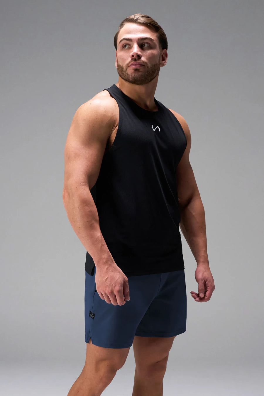 Blue men’s Apex 365 7 Inch Shorts feature a 7 inch inseam, designed for training, and all-day gym to street wear by TLF Apparel – details view 