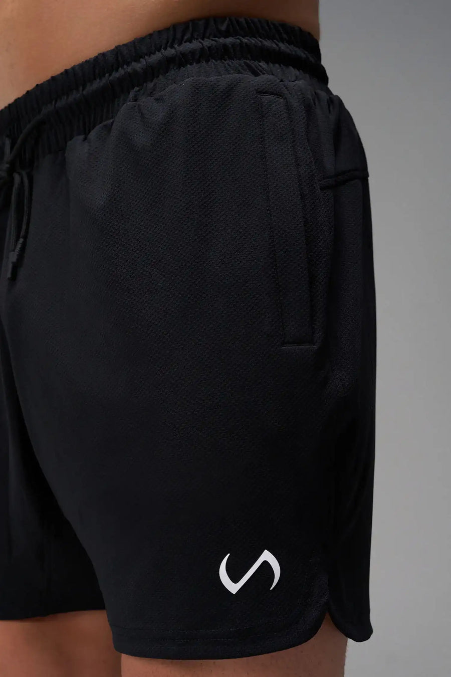 Black Men’s Micro Mesh 7 Inch Shorts with 7-inch inseam, designed for gym training, HIIT workouts and running by TLF Apparel – side view 