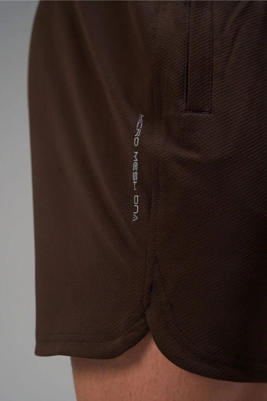 Brown Men’s Micro Mesh 7 Inch Shorts with 7-inch inseam, designed for gym training, HIIT workouts and running by TLF Apparel – detail logo view 