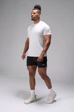 Black Adapt Performance 5 inch Shorts showing athletic side profile with side split performance hem by TLF Apparel – side view
