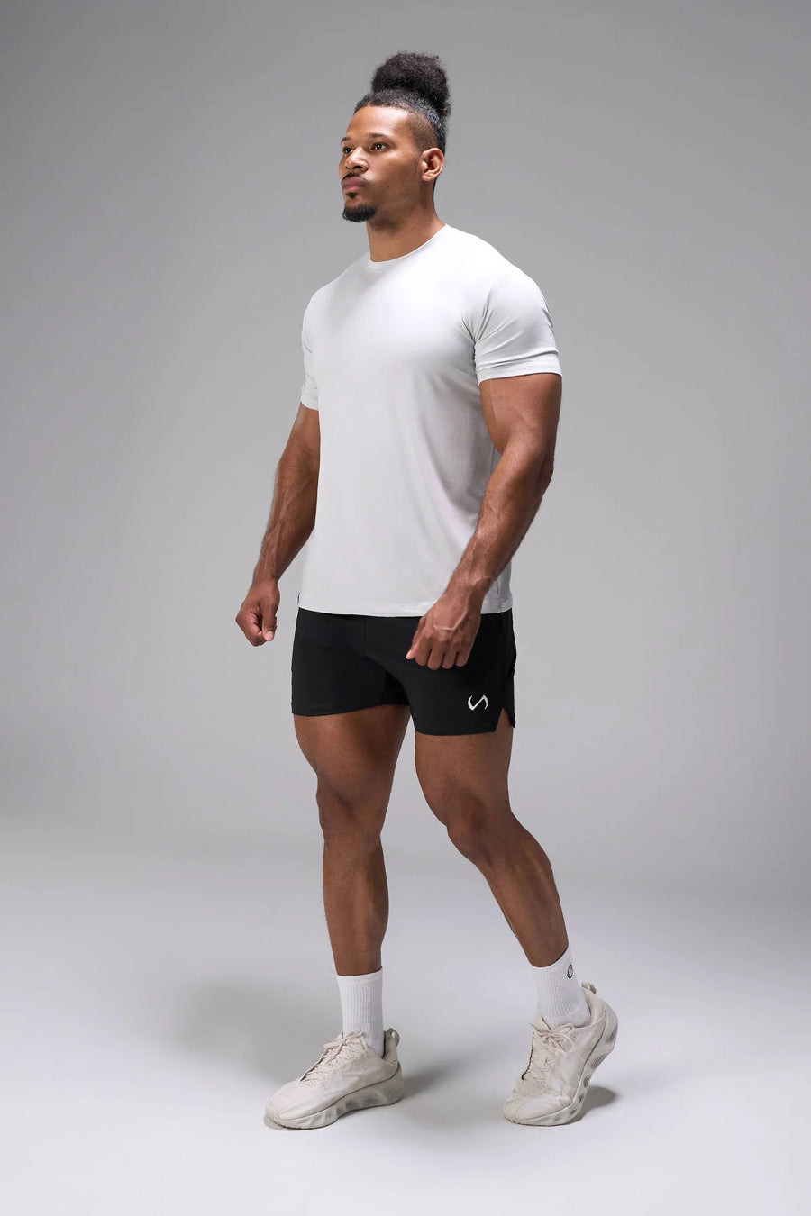 Black Adapt Performance 5 inch Shorts showing athletic side profile with side split performance hem by TLF Apparel – side view