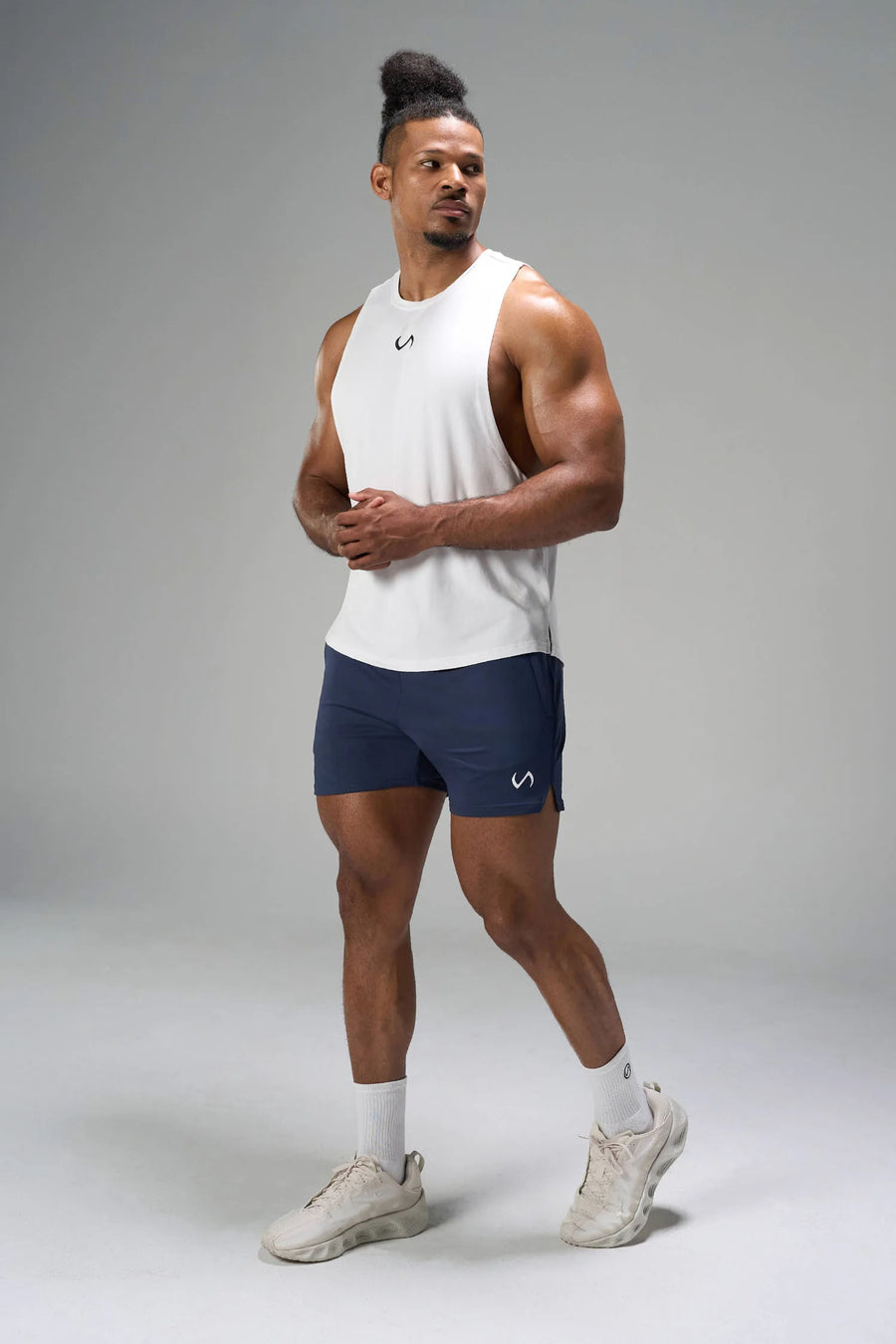 Blue Adapt Performance 5 inch Shorts showing athletic side profile with side split performance hem by TLF Apparel – side view