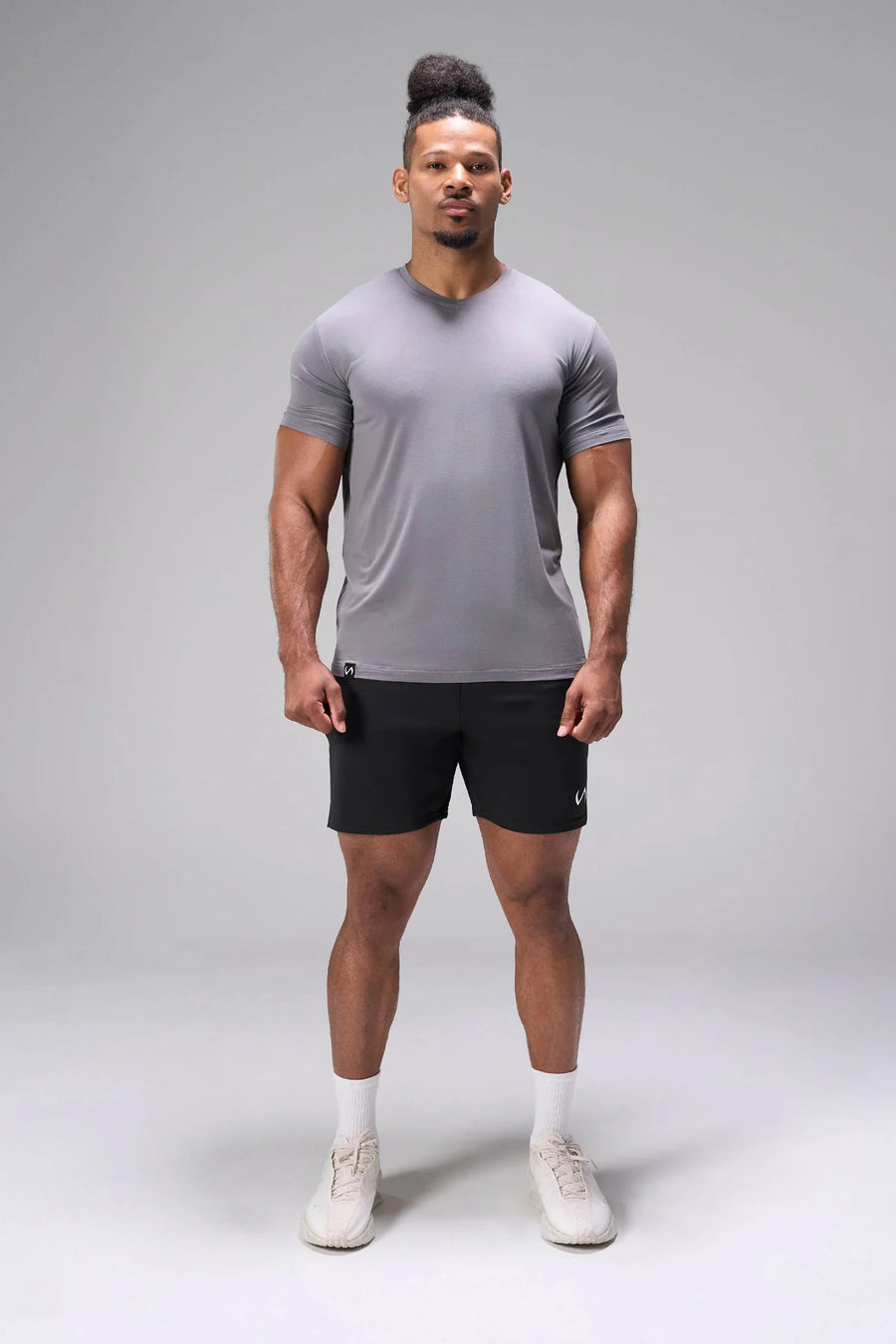 Black Adapt Performance 7 Inch Shorts with 4-way stretch performance fabric and secure zipper pockets for workouts and gym training by TLF Apparel – front view