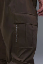 Front View of Brown TLF Element Athletic Joggers 2.0, featuring side zipper pockets and side leg cargo pockets and reflective details 
