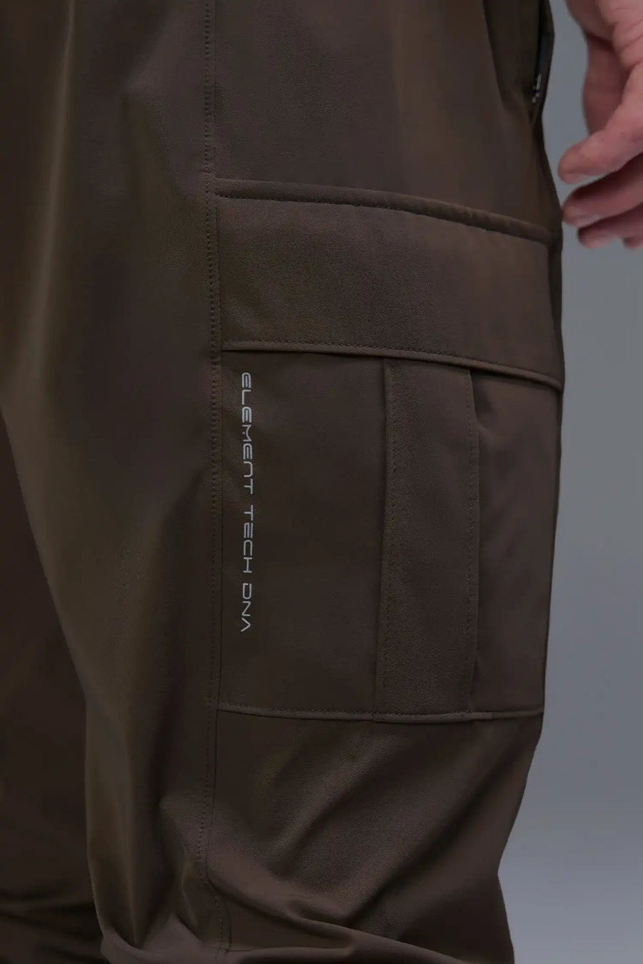 Front View of Brown TLF Element Athletic Joggers 2.0, featuring side zipper pockets and side leg cargo pockets and reflective details 