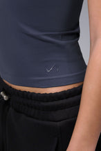 Women’s armada essential seamless short sleeve top with contouring fit for gym and lifestyle by TLF Apparel – detail logo view