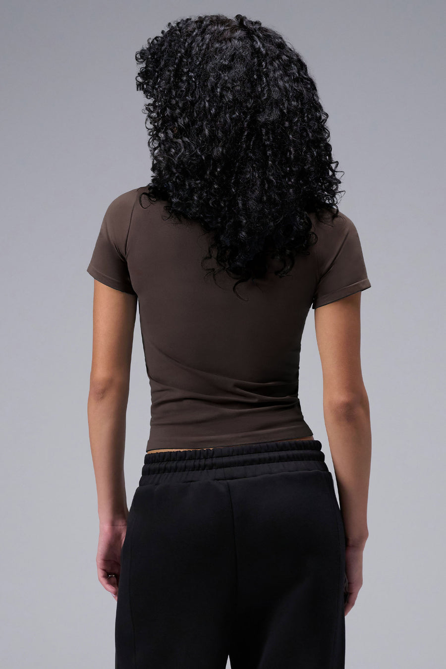 Women’s dark oak essential seamless short sleeve top with contouring fit for gym and lifestyle by TLF Apparel – back view