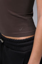 Women’s dark oak essential seamless short sleeve top with contouring fit for gym and lifestyle by TLF Apparel – detail logo view