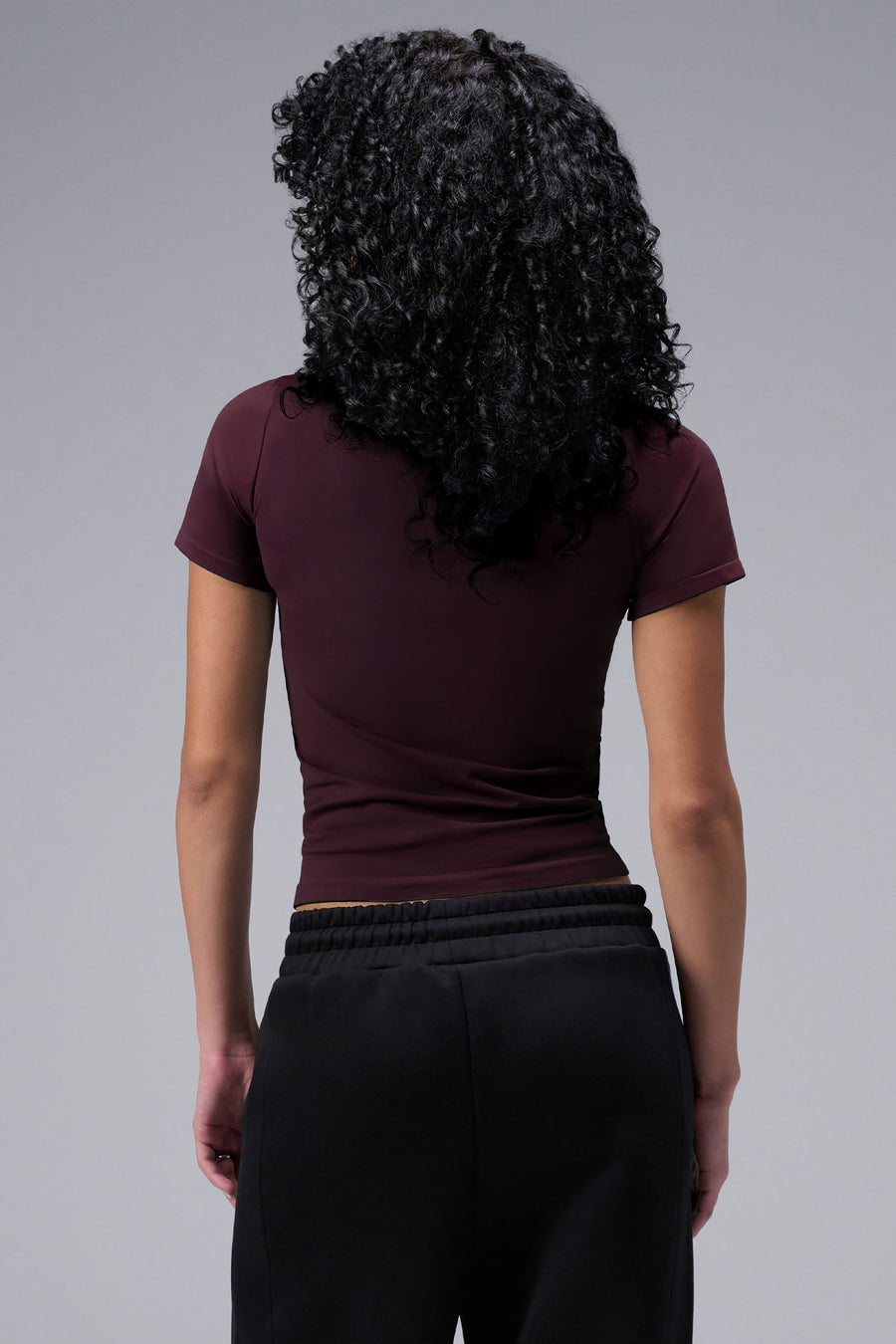 Women’s wine essential seamless short sleeve top with contouring fit for gym and lifestyle by TLF Apparel – back view