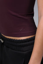 Women’s wine essential seamless short sleeve top with contouring fit for gym and lifestyle by TLF Apparel – detail logo view