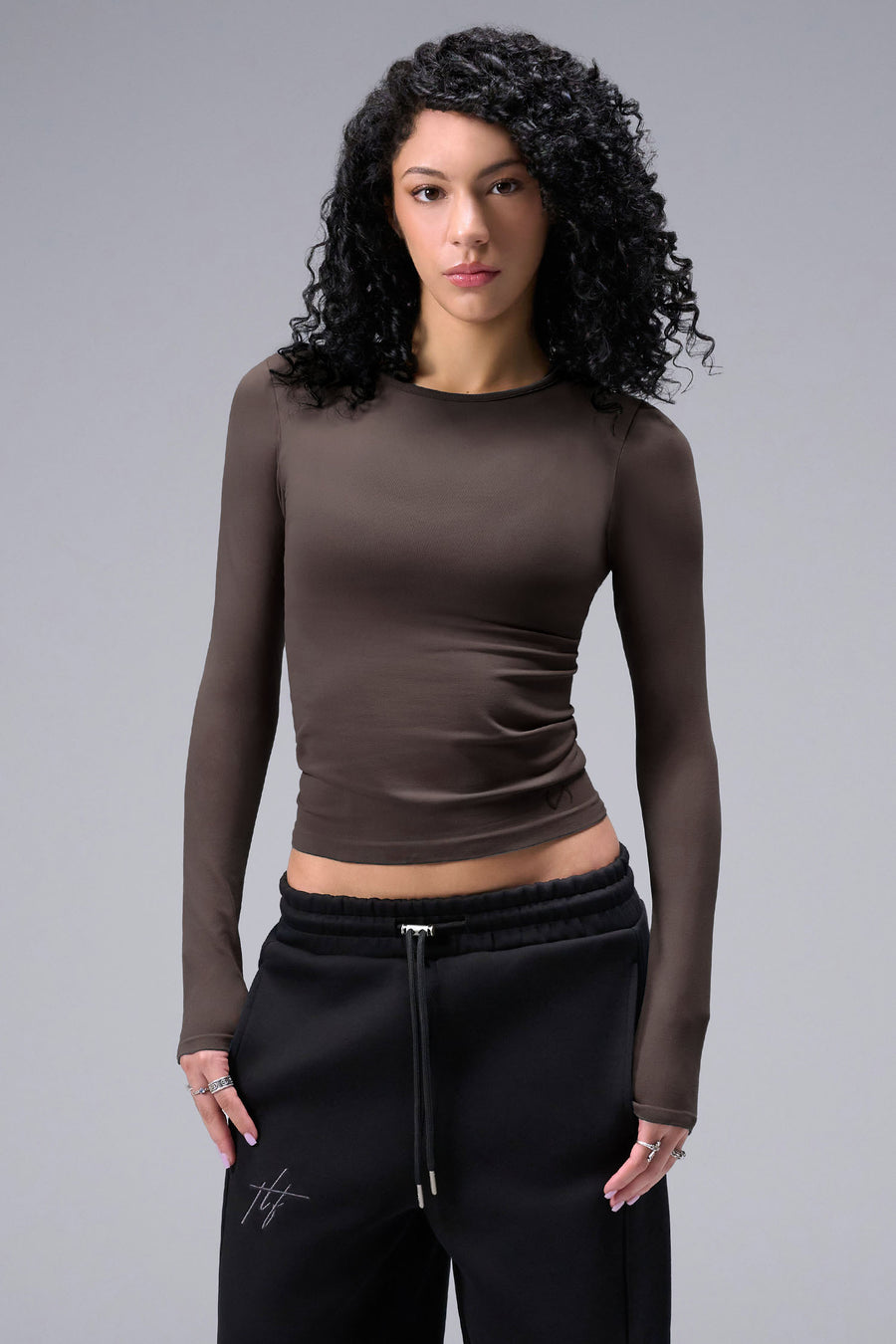 Women’s dark oak essential seamless long sleeve top with contouring fit for gym and lifestyle by TLF Apparel – main front view