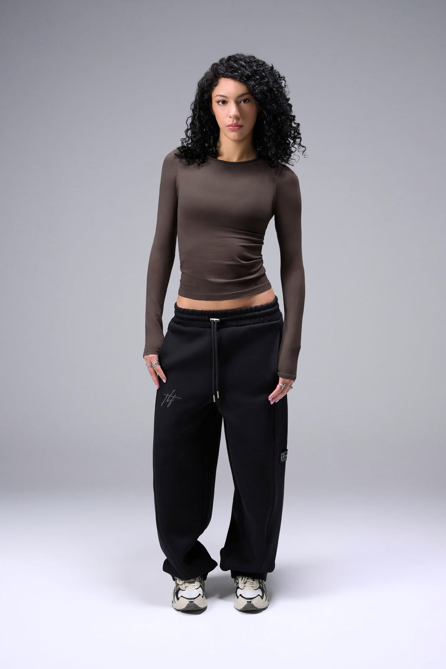 Women’s dark oak essential seamless long sleeve top with contouring fit for gym and lifestyle by TLF Apparel – full body front view