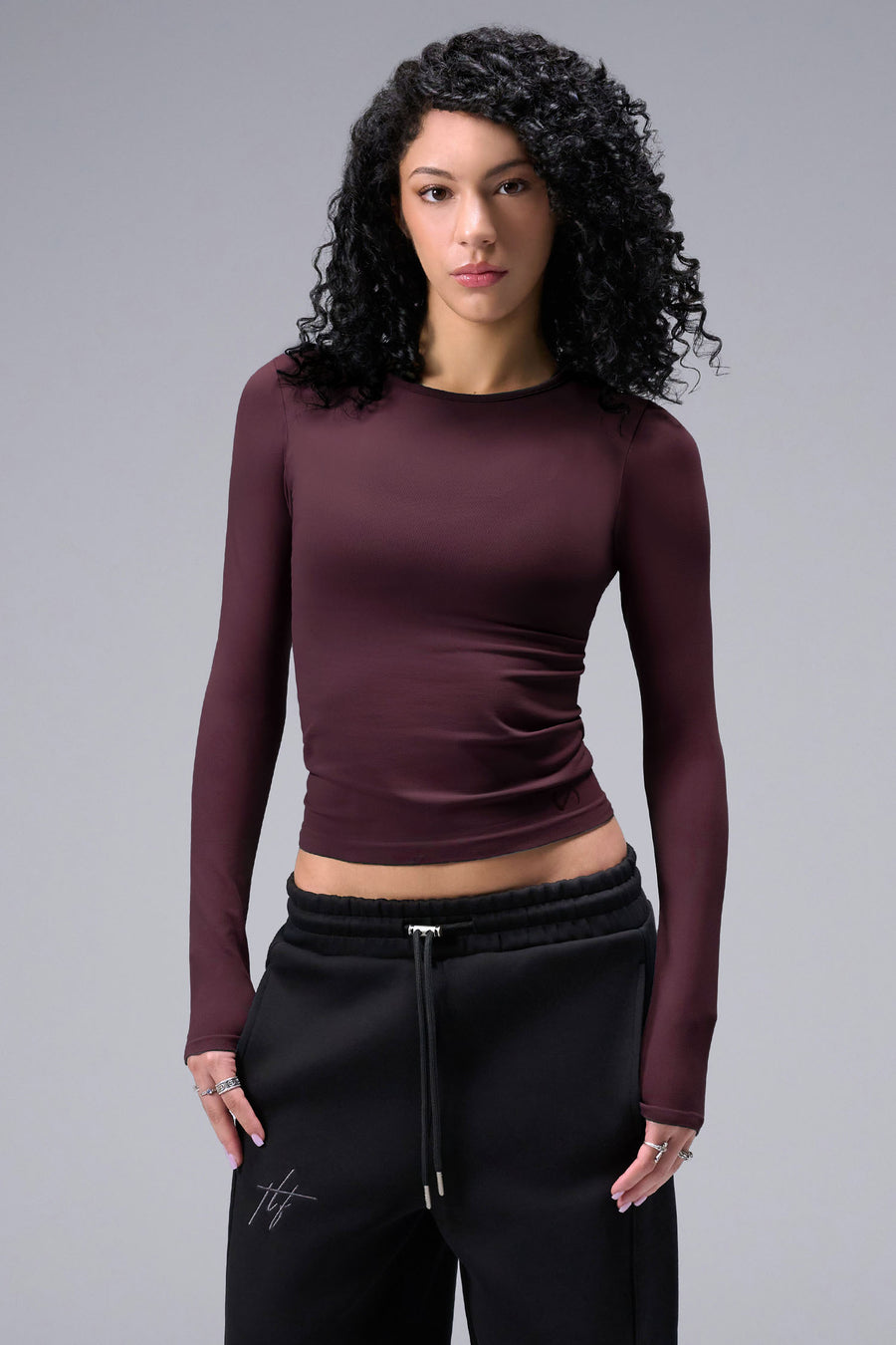Women’s wine essential seamless long sleeve top with contouring fit for gym and lifestyle by TLF Apparel – main front view