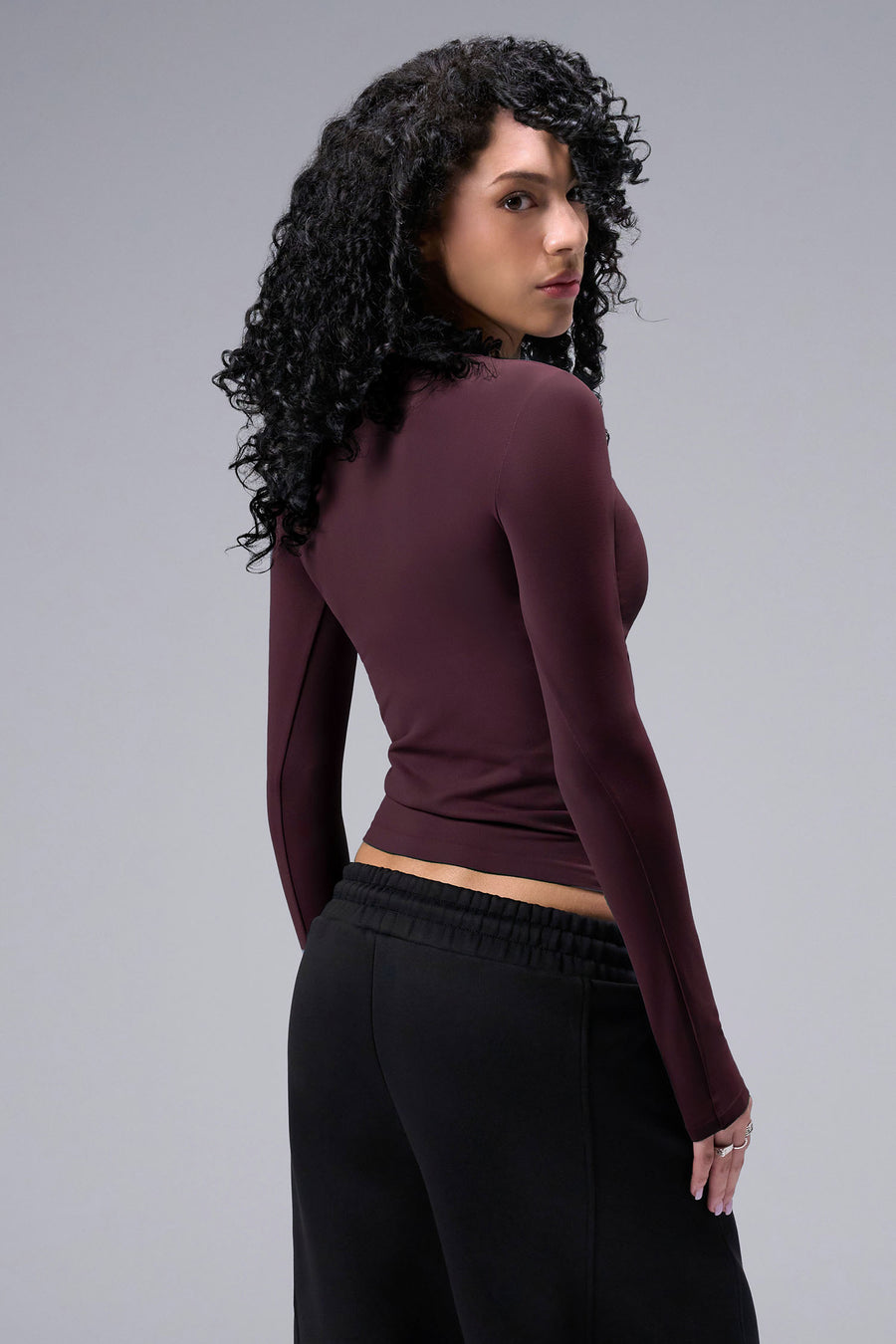 Women’s wine essential seamless long sleeve top with contouring fit for gym and lifestyle by TLF Apparel – back view