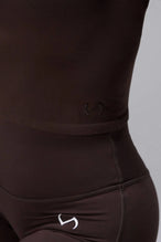Detail Close View of Brown TLF Essential Seamless Mock Neck Long Sleeve, featuring thumbholes and mock neck for gym to street versatility