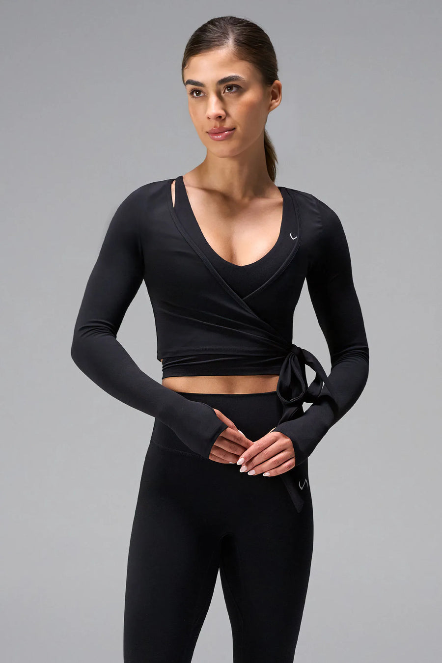 Black NeoCloud™ wrap top with long sleeves and wrap design for multiple styling options by TLF Apparel – front view 
