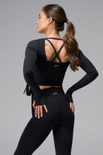 Black NeoCloud™ wrap top with long sleeves and wrap design for multiple styling options by TLF Apparel – back view 