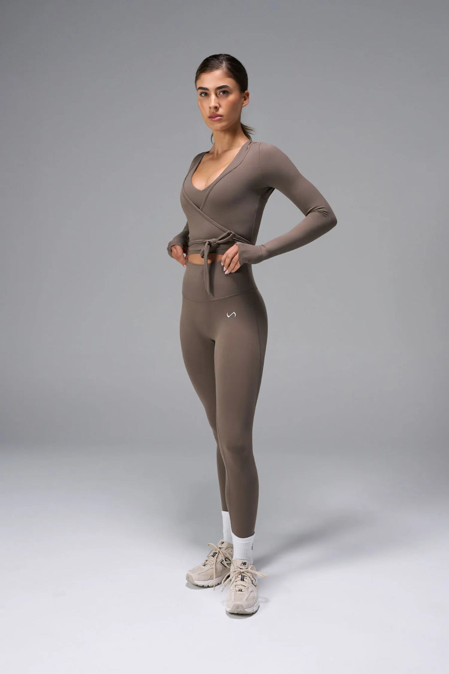 Brown NeoCloud™ wrap top with long sleeves and wrap design for multiple styling options by TLF Apparel – front view 