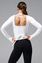 White NeoCloud™ wrap top with long sleeves and wrap design for multiple styling options by TLF Apparel – back view 
