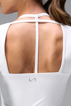 White NeoCloud™ wrap top with long sleeves and wrap design for multiple styling options by TLF Apparel – back view 