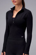 Black Cosmic Seamless 1/4 Zip with sculpting seamless fabric for workouts and training by TLF Apparel – side view