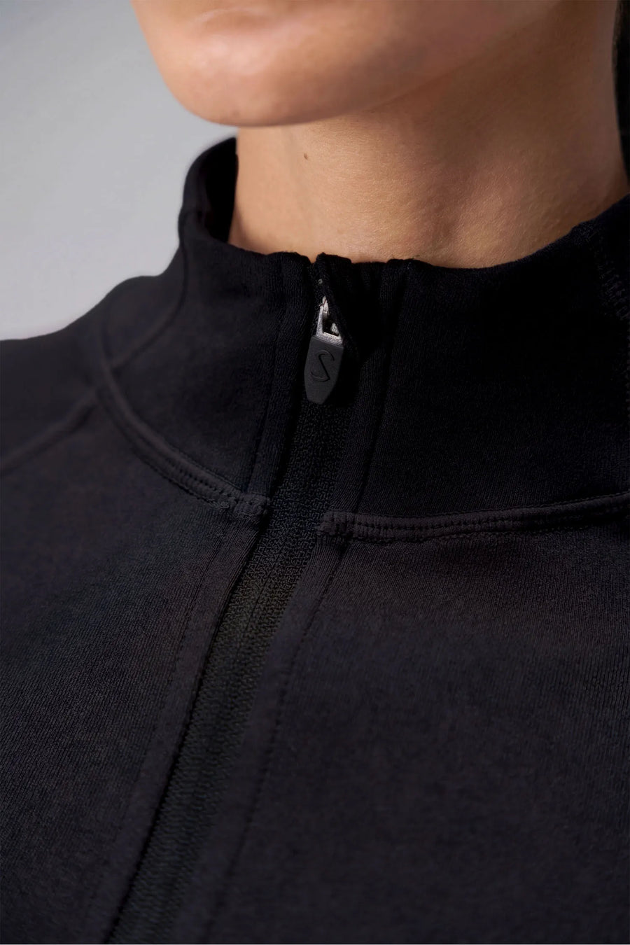 Black Cosmic Seamless 1/4 Zip showing sculpted side fit and breathable seamless knit fabric by TLF Apparel – detail view 