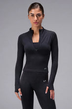 Black Cosmic Seamless 1/4 Zip, seamless long sleeve workout top with cropped fit and quarter zip neckline for gym training and workouts by TLF Apparel – front view 