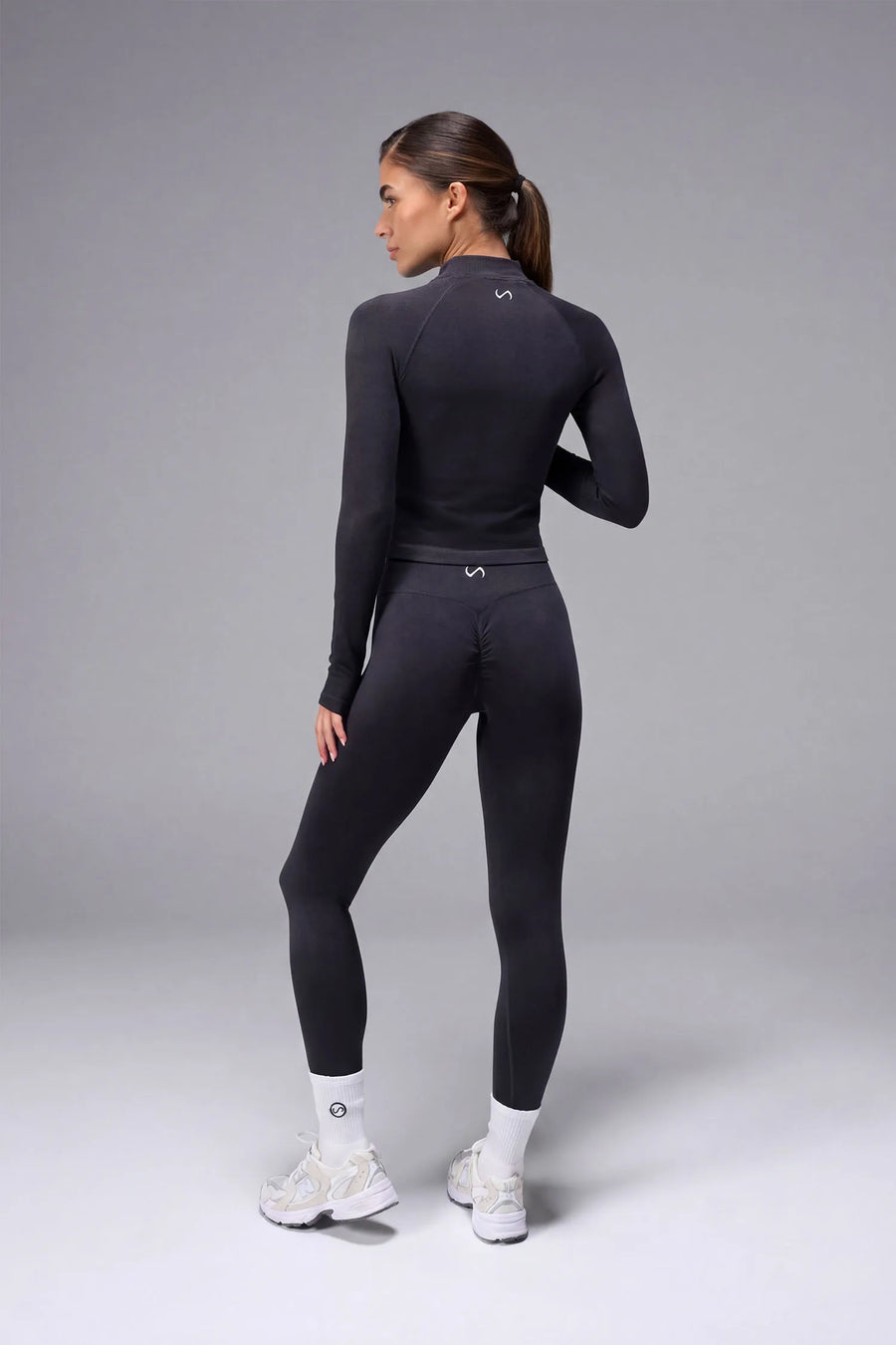 Black Cosmic Seamless 1/4 Zip showing seamless contour knit fabric and quarter zip neckline detail by TLF Apparel – back view 