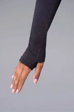 Black Cosmic Seamless 1/4 Zip showing fitted side silhouette and sculpting seamless fabric by TLF Apparel – detail view