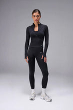 Black Cosmic Seamless 1/4 Zip with raglan sleeves and seamless sculpting fit for workouts and training by TLF Apparel – front view 