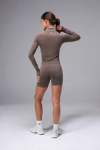 Brown Cosmic Seamless 1/4 Zip showing seamless contour knit fabric and quarter zip neckline detail by TLF Apparel – back view 