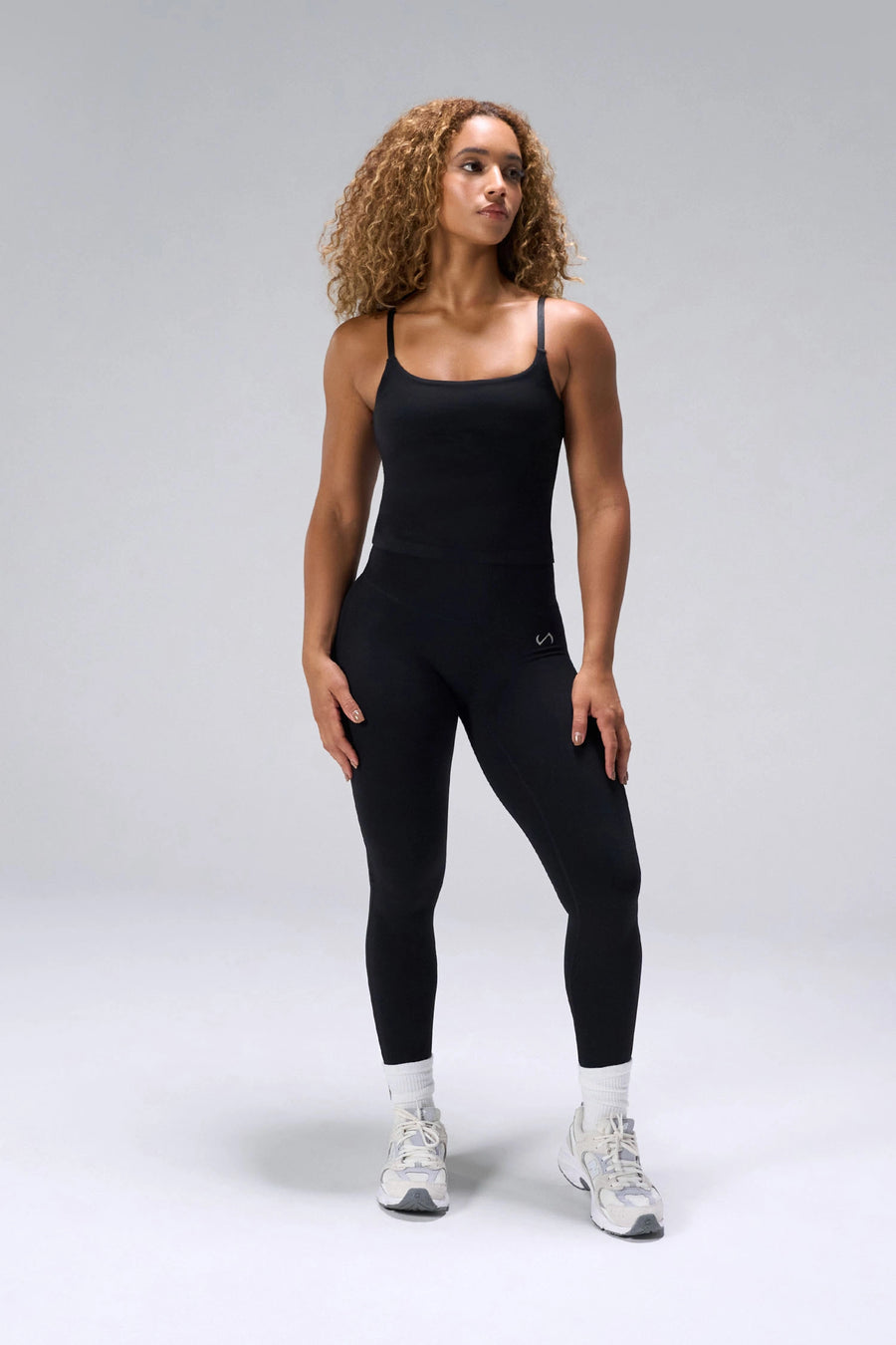 Black NeoCloud™ Built In Bra Tank with shelf bra and adjustable straps for everyday wear by TLF Apparel – front view