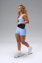 Blue NeoCloud™ Built In Bra Tank showing longline fit, built in shelf bra, and breathable fabric by TLF Apparel – side view