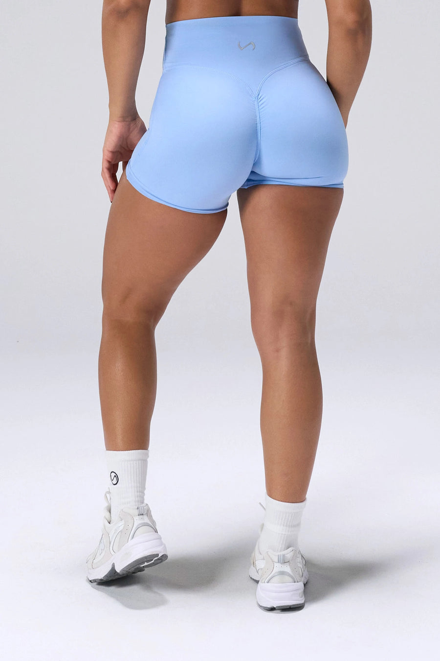 Blue NeoCloud™ 4 Inch Secret Glute Seam Shorts showing scrunch lift and sculpted silhouette by TLF Apparel – back view 