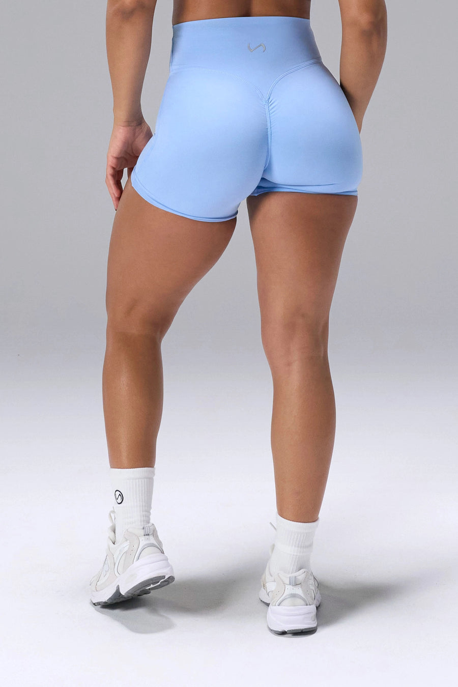 Blue NeoCloud™ 4 Inch Secret Glute Seam Shorts showing scrunch lift and sculpted silhouette by TLF Apparel – back view 