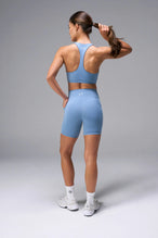 Blue Tempo 6 Inch Gym Shorts With Pockets showing sculpted fit and dual side phone pockets by TLF Apparel – back view