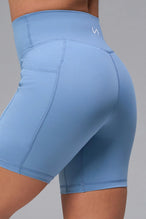 Blue Tempo 6 Inch Gym Shorts With Pockets showing sculpted fit and mid thigh length by TLF Apparel – side view
