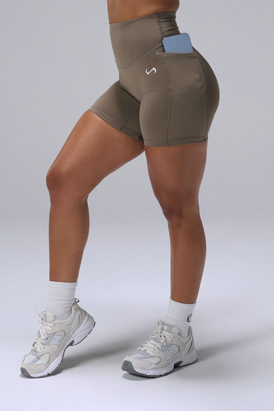 Brown Tempo 6 Inch Gym Shorts With Pockets showing sculpted fit and dual side phone pockets by TLF Apparel – side view