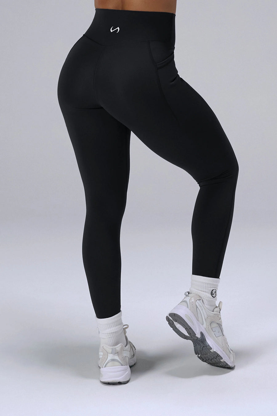 Black Tempo Leggings With Pockets featuring a sculpting high waisted waistband and full-length fit by TLF Apparel – back view