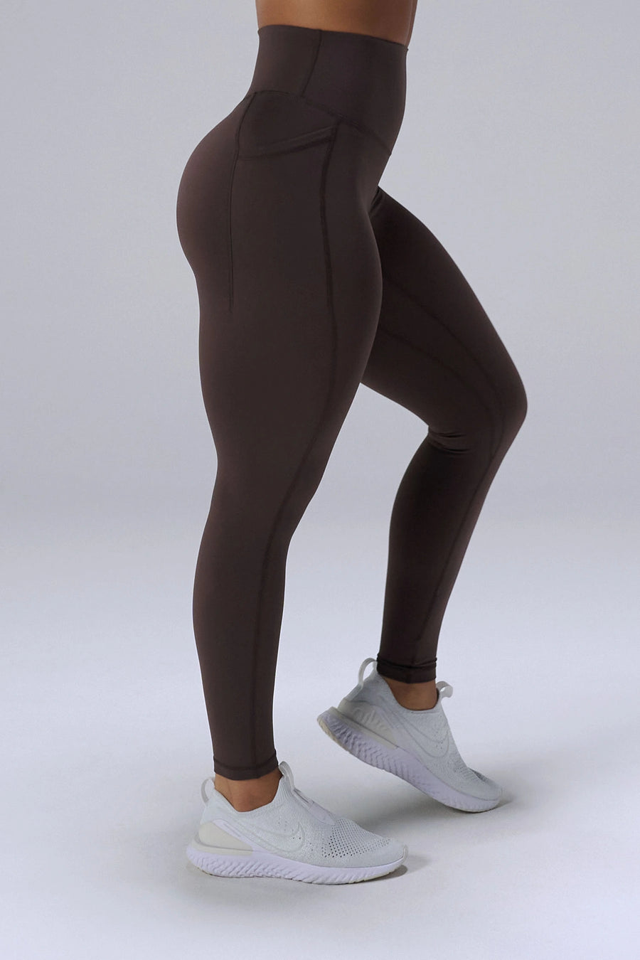 Brown Tempo Leggings With Pockets showing sculpted fit and dual side phone pockets by TLF Apparel – side view